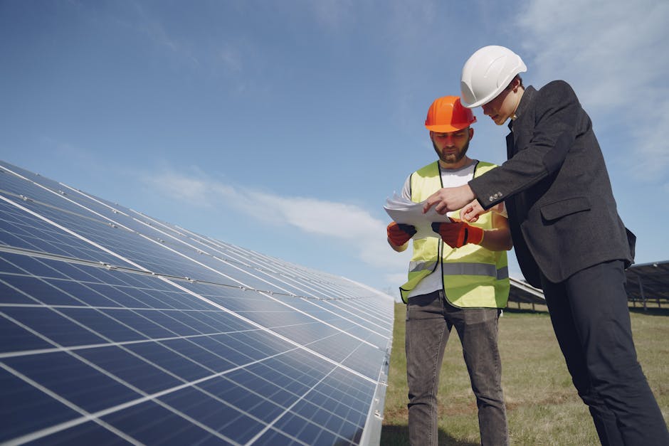 Electricians inspecting solar panels
